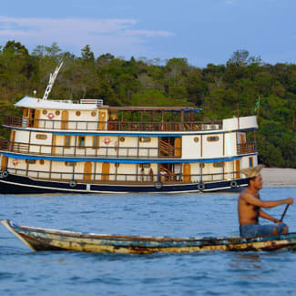 Small skiff and the ship in the background