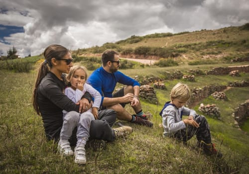 Happy Family Enjoying The View In the Sacred valley Of The Incas In Cusco - Peru