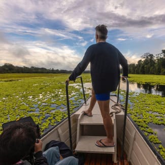 A man on a small boat during the excursion
