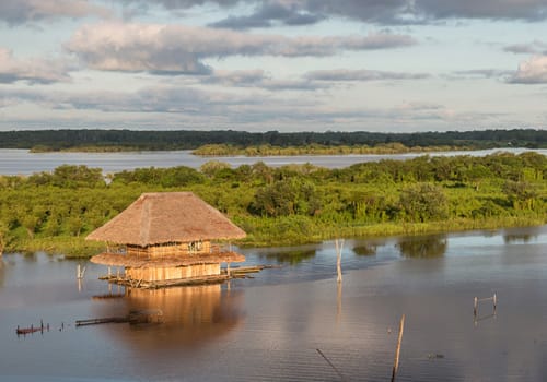 Panoramic View Of A Traditional House And The Amazon River
